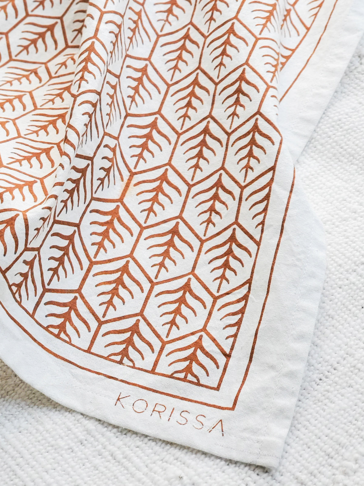Printed tea towels with closeup of Korissa label 