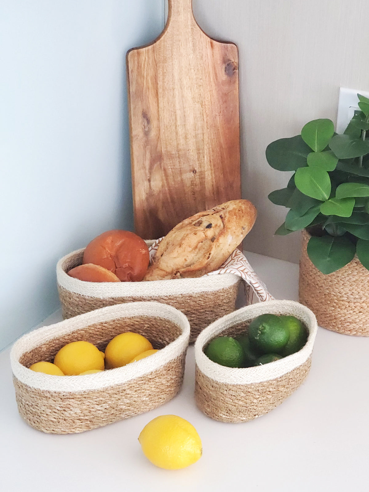 oval seagrass stroage baskets styled with fruit